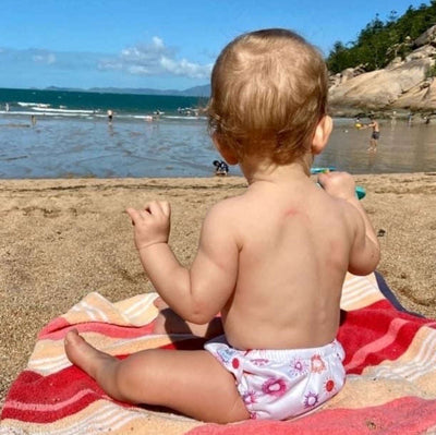 Baby wearing reusable swim nappies
