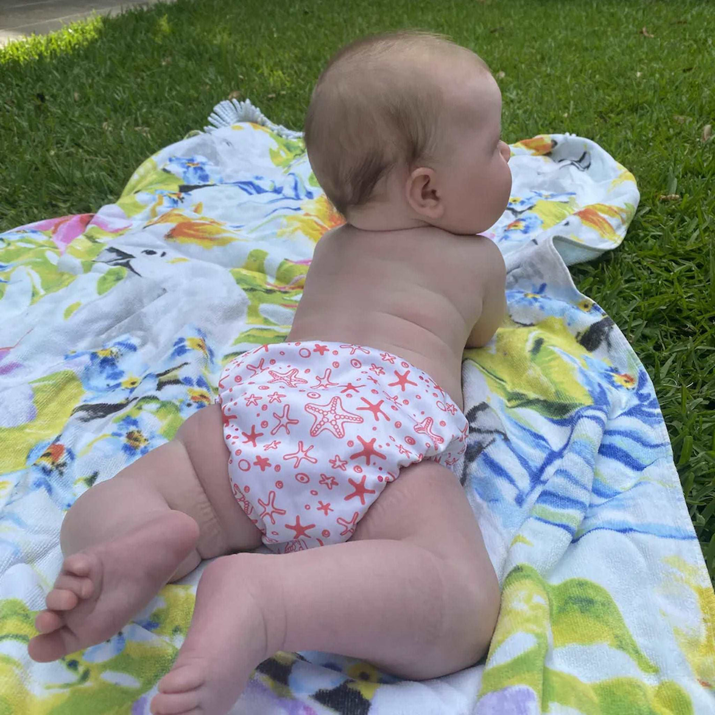Baby wearing reusable swim nappies