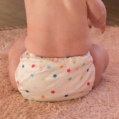Cloth nappy fitted on baby